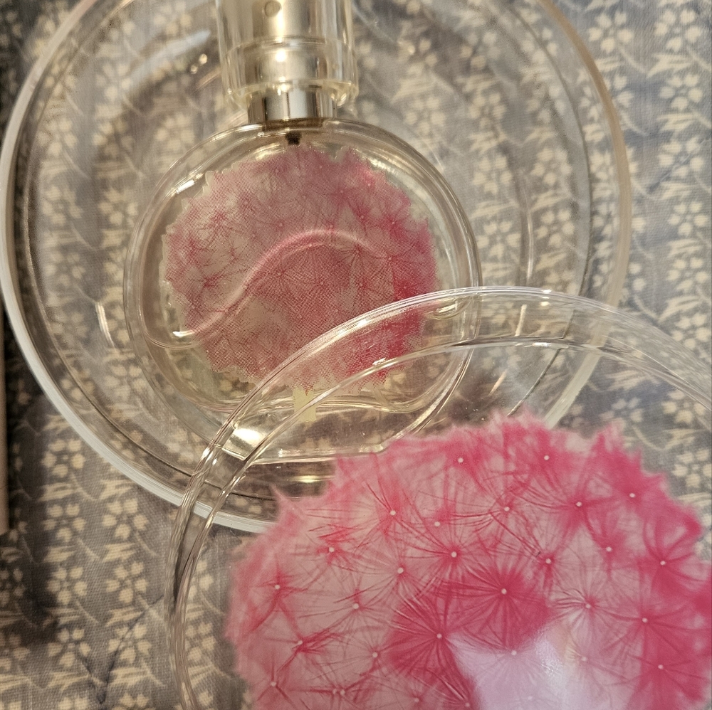 This listing is for a Beautiful bottle of purfume in a beautiful container.  M